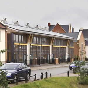 View Zero Carbon Terraced Housing - View of front with maximum south facing glazing